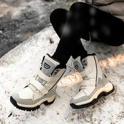 Woman wearing HexoComfy™ Women's Orthopedic High-Top Winter Boots in Beige on snow