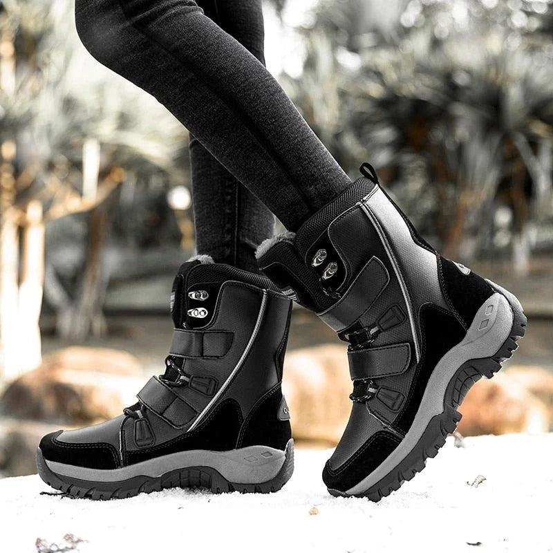 Woman wearing HexoComfy™ Women's Orthopedic High-Top Winter Boots in Black on snow