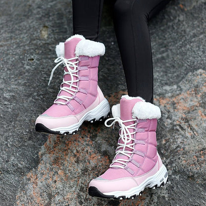 Woman wearing HexoComfy™ Women's Orthopedic Winter Boots in Pink on rocky ground